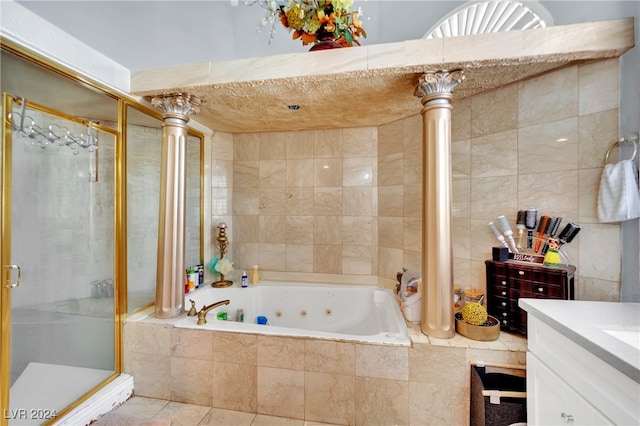 bathroom featuring vanity, separate shower and tub, and decorative columns