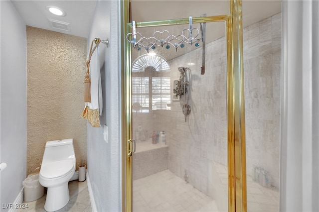 bathroom with tile patterned floors, toilet, and walk in shower