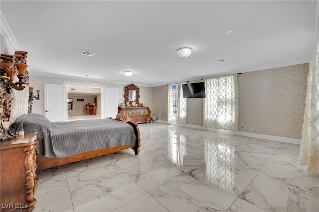 bedroom with ornamental molding