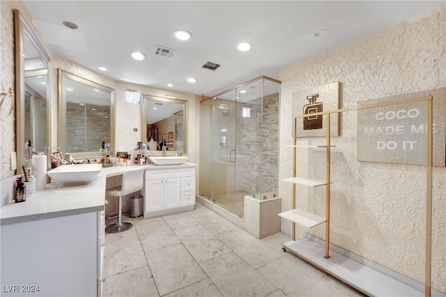 bathroom with vanity and walk in shower