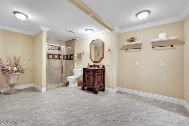 bathroom with toilet, crown molding, walk in shower, and vanity