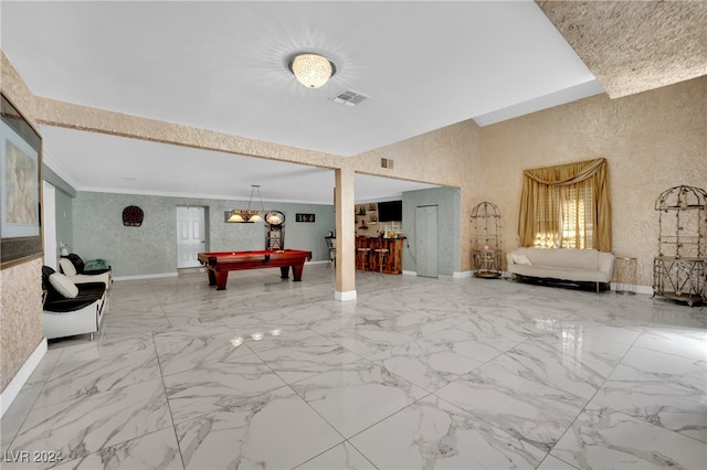 recreation room with pool table and crown molding