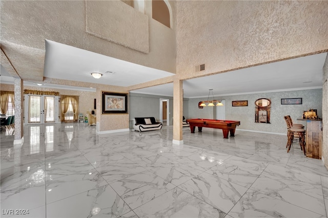 playroom with french doors, billiards, and crown molding