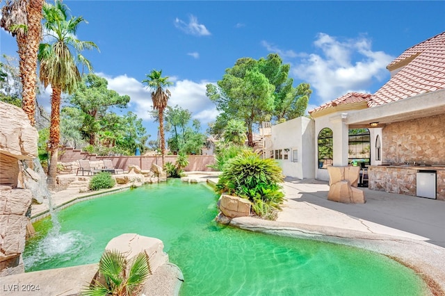 view of swimming pool featuring a patio area