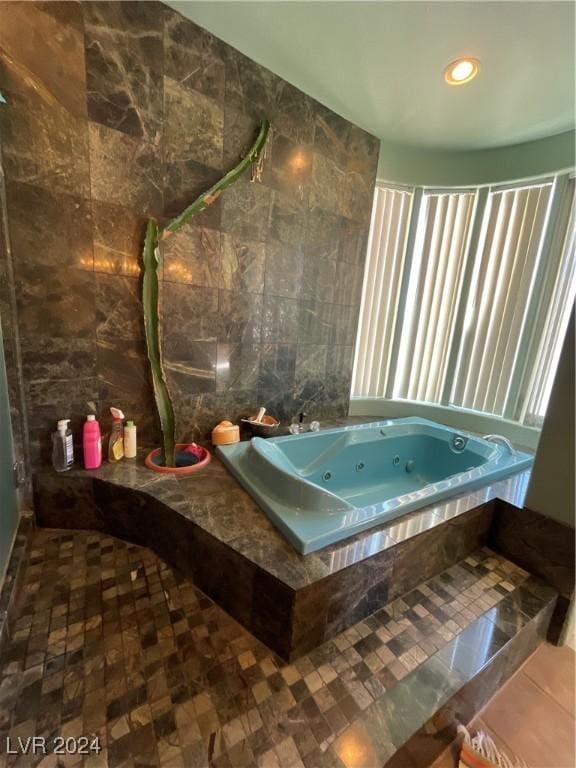 291E Madison Ave, Ely, NV 89301 - full bath featuring tile walls, a whirlpool tub, and recessed lighting