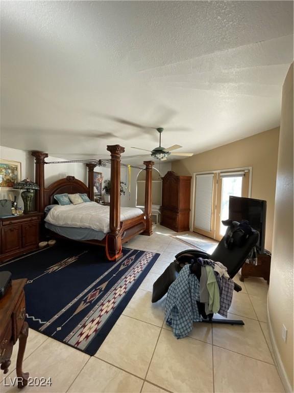 291E Madison Ave, Ely, NV 89301 - bedroom with a textured ceiling, decorative columns, and tile patterned flooring
