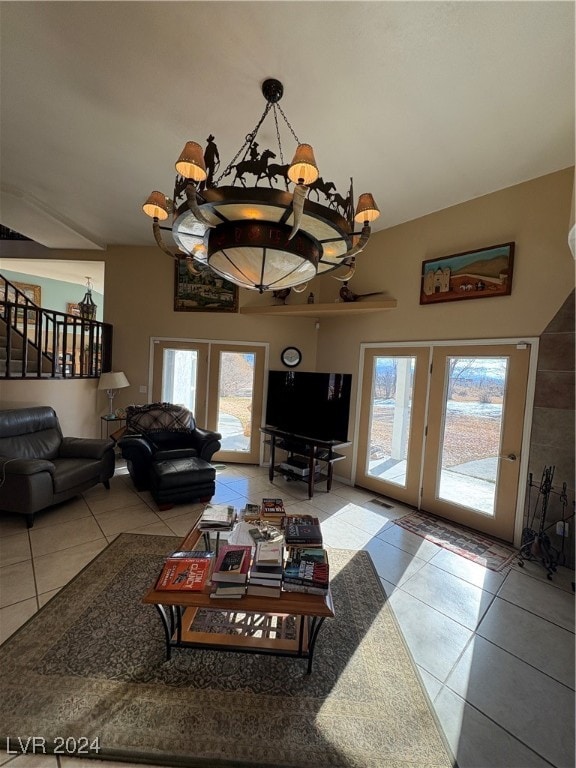 291E Madison Ave, Ely, NV 89301 - living room with french doors, tile patterned flooring, lofted ceiling, and healthy amount of natural light