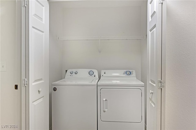 washroom with independent washer and dryer