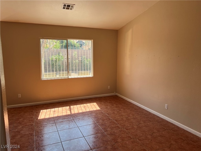 view of tiled spare room