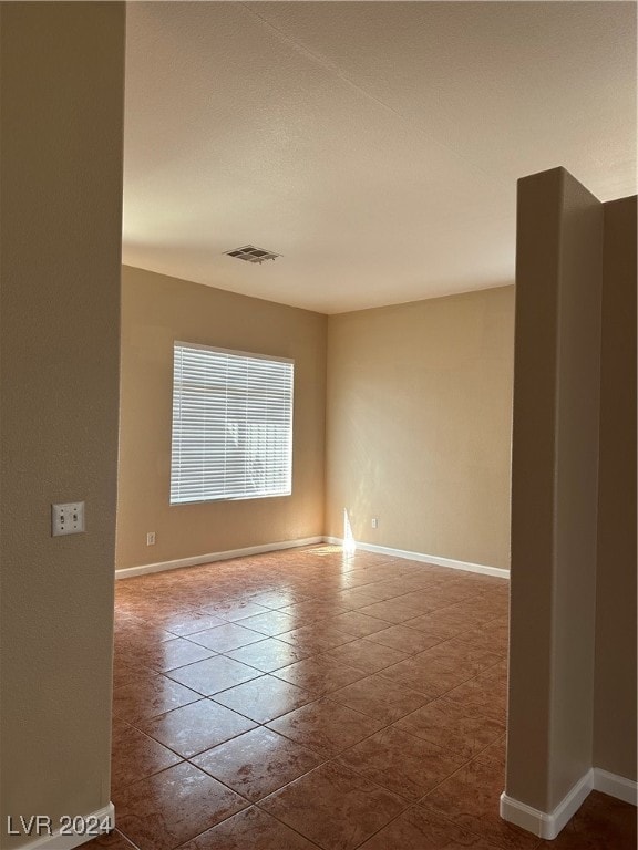 view of tiled spare room