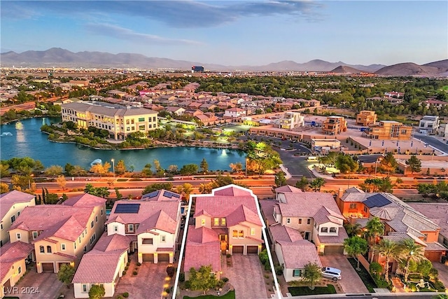 bird's eye view with a water and mountain view