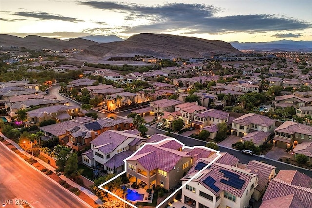 aerial view at dusk with a mountain view