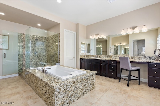 bathroom featuring separate shower and tub and vanity