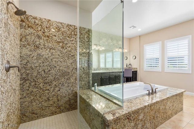 bathroom featuring tile patterned flooring, plus walk in shower, and vanity