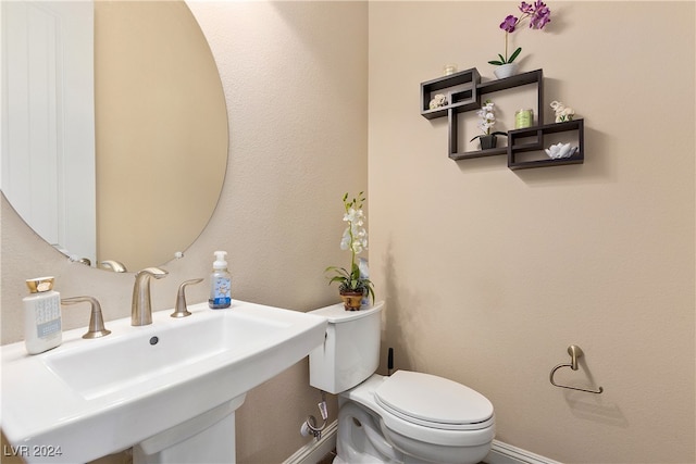 bathroom with sink and toilet