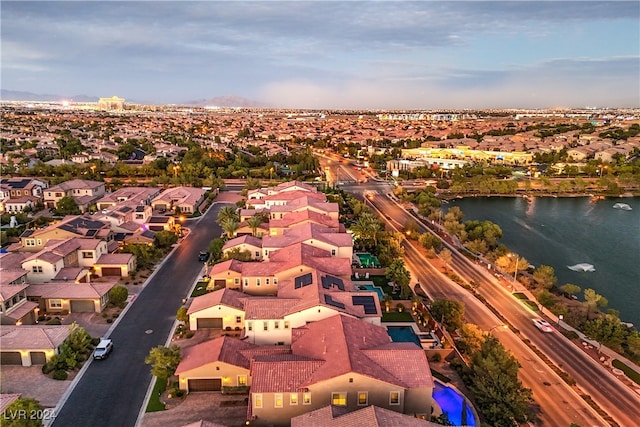 aerial view at dusk with a water view