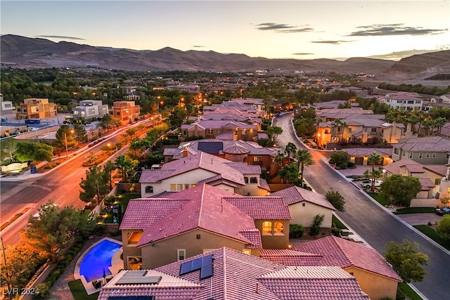 aerial view at dusk with a mountain view