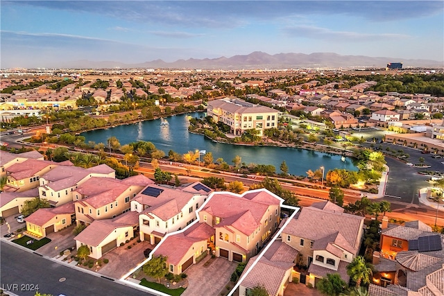 bird's eye view featuring a water and mountain view