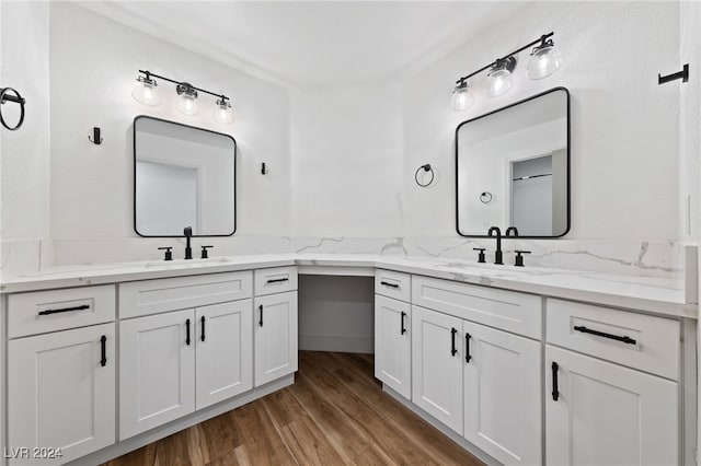 bathroom with hardwood / wood-style flooring and vanity