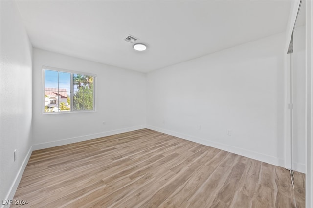 unfurnished room with light hardwood / wood-style floors