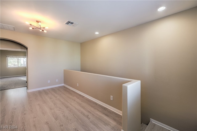 unfurnished room with light wood-type flooring