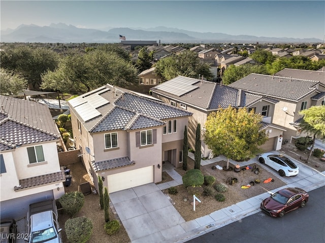 birds eye view of property with a mountain view