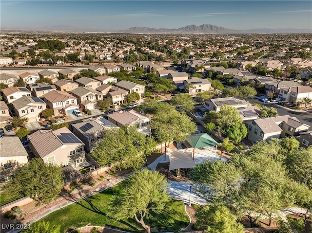 birds eye view of property with a mountain view