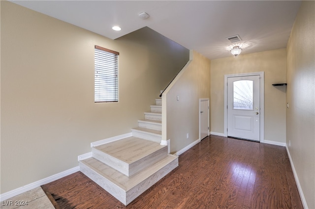 foyer entrance with dark hardwood / wood-style flooring