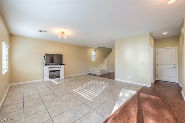 unfurnished living room featuring light wood-type flooring