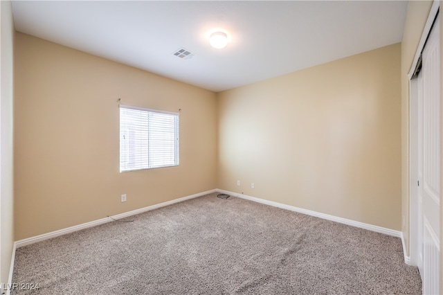 unfurnished room with carpet flooring