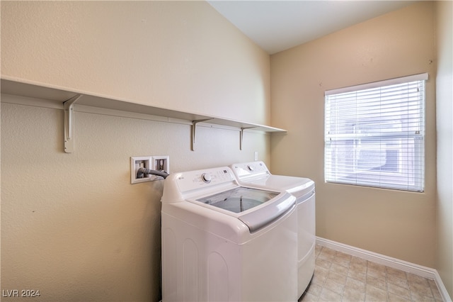 laundry area with separate washer and dryer