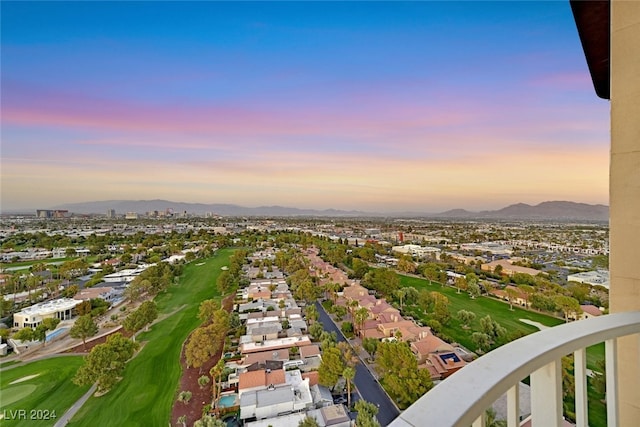 aerial view at dusk featuring a mountain view