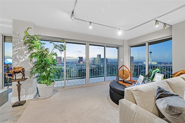 3111 Bel Air Dr Unit 25A, Las Vegas, NV 89109 - living room featuring track lighting, a view of city, and baseboards