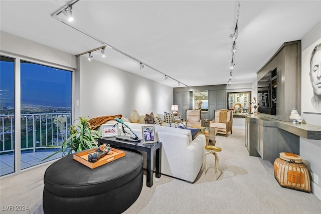 3111 Bel Air Dr Unit 25A, Las Vegas, NV 89109 - carpeted living area featuring track lighting