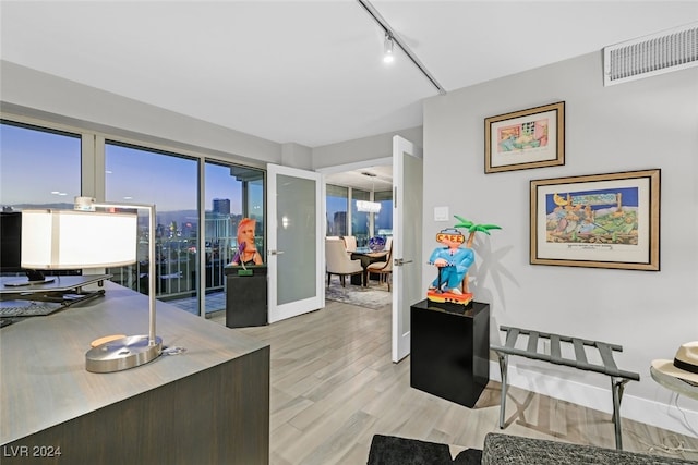 3111 Bel Air Dr Unit 25A, Las Vegas, NV 89109 - office space featuring light wood-style flooring, track lighting, and baseboards