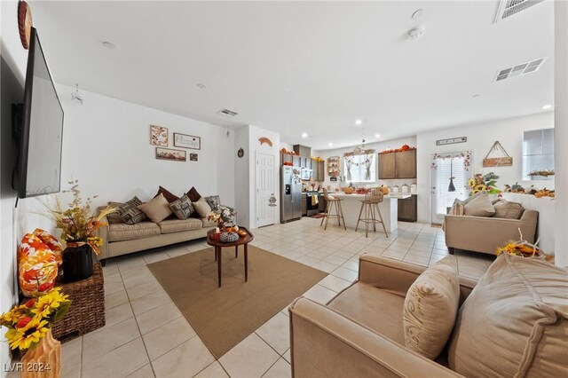 living room with light tile patterned flooring