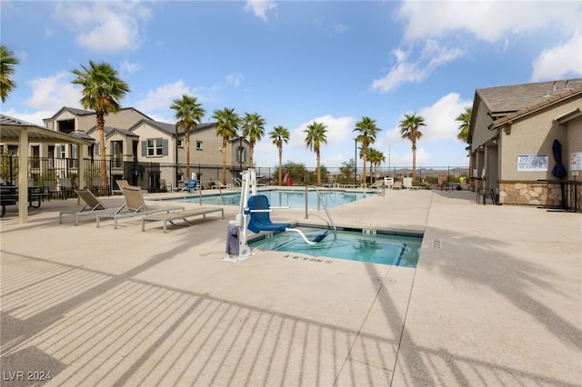 view of swimming pool with a patio