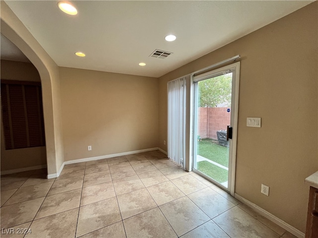 spare room with light tile patterned floors