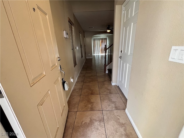 hallway featuring light tile patterned floors