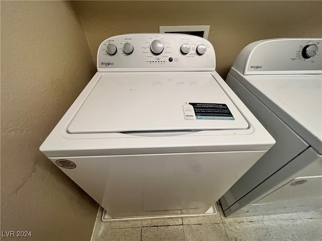 clothes washing area with washer and dryer