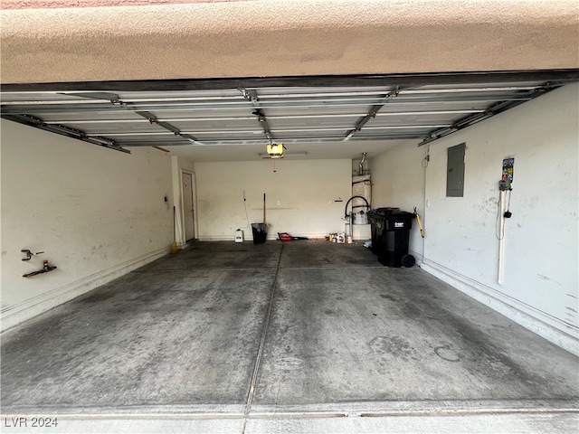 garage featuring a garage door opener and electric panel