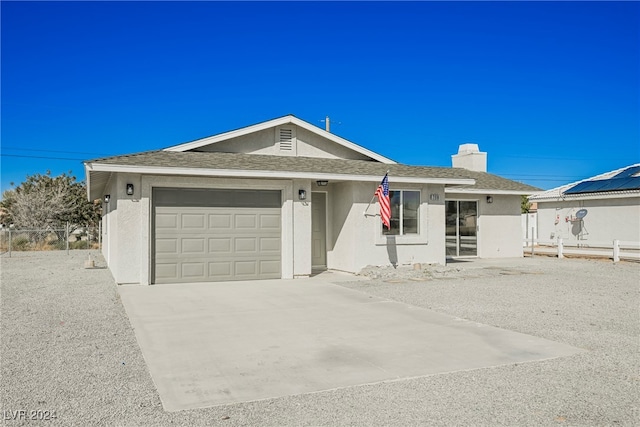 single story home featuring a garage