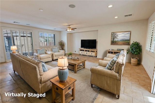 living room featuring ceiling fan