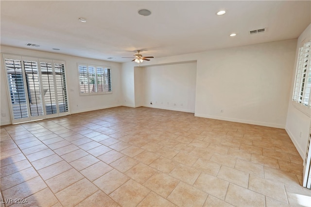 unfurnished room with ceiling fan