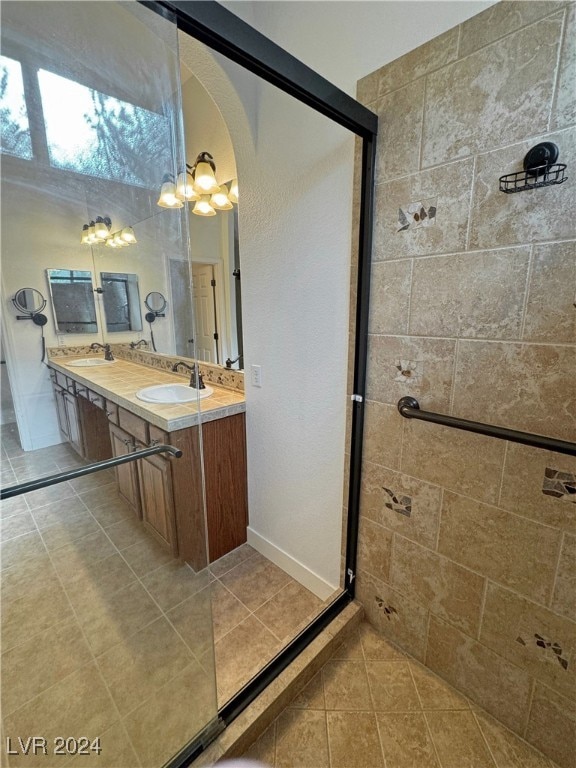 bathroom with vanity, tile patterned floors, and walk in shower