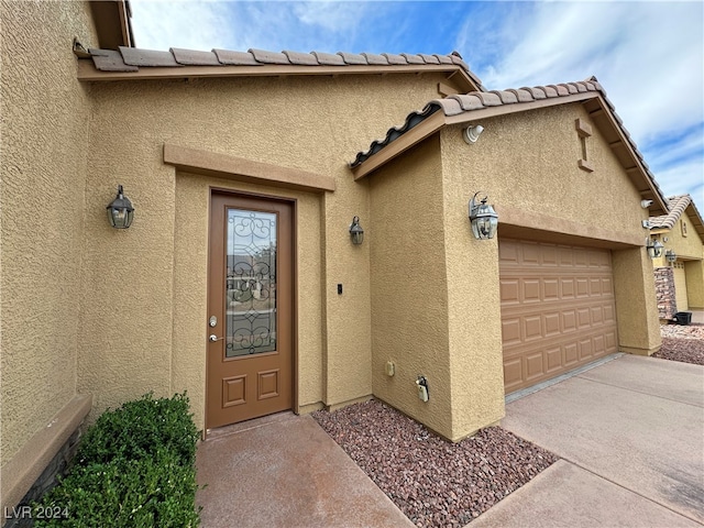 entrance to property featuring a garage