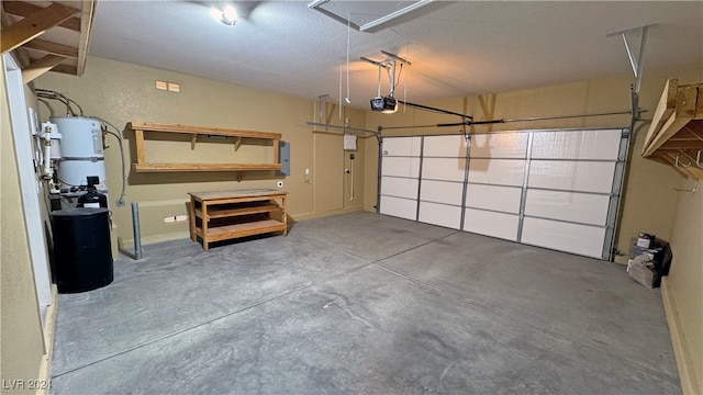 garage featuring a garage door opener, electric panel, and strapped water heater