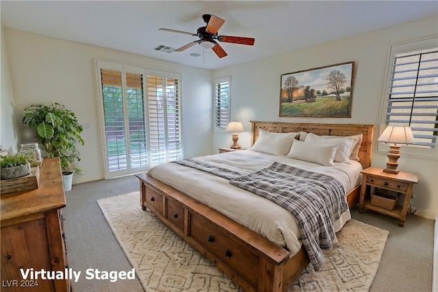 carpeted bedroom featuring ceiling fan and access to outside