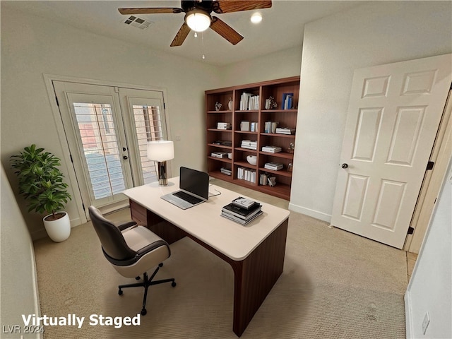 office featuring french doors, light carpet, and ceiling fan