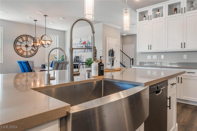 kitchen featuring dishwasher, hanging light fixtures, white cabinetry, dark wood-type flooring, and a notable chandelier